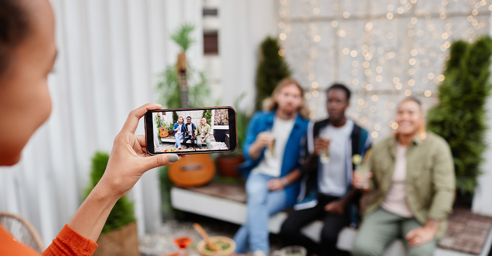 Capturing a group photo with a smartphone - demonstrating how to use Instagram for business effectively